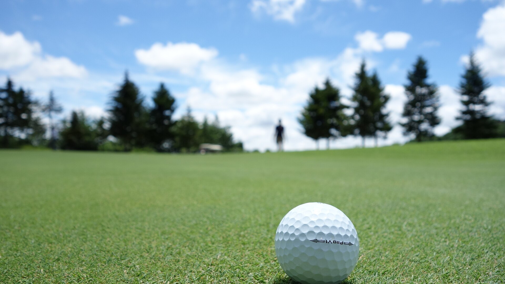 A golf ball sitting on a putting green